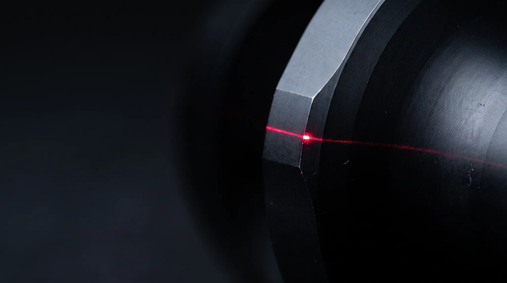 Macro photograph of a machined WENEX product edge, showing the finish and radius