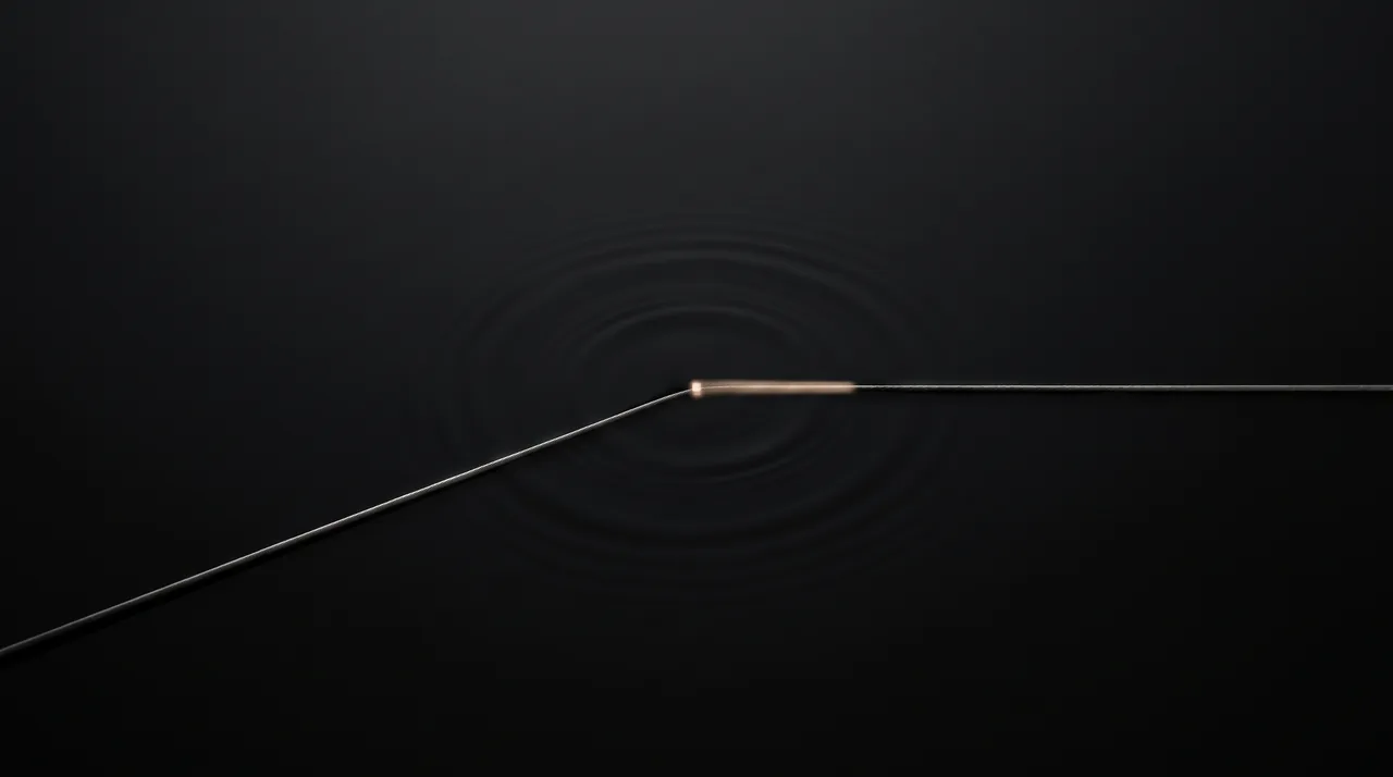 A single point of warm light on a taut wire, with faint concentric waves spreading outward across a matte black surface